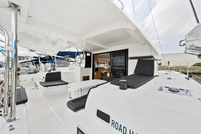 Slide: The Image of Lagoon 42 catamaran 2018 model, spacious deck with seating and helm station. - 22