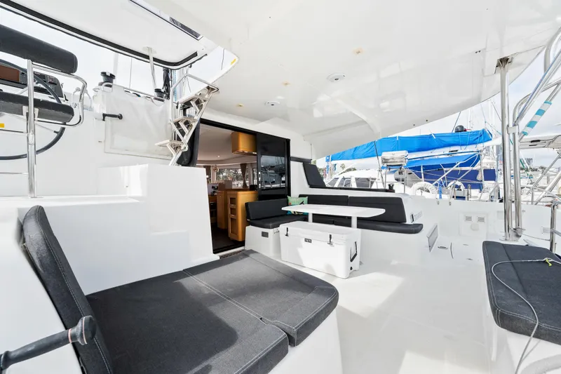 Slide: The Image of Spacious deck of 2018 Lagoon 42 catamaran with seating and dining area. - 23