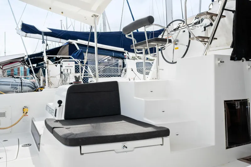 Slide: The Image of Lagoon 42 catamaran 2018 model cockpit with seating and helm station. - 30