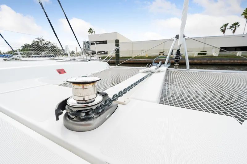 Slide: The Image of Lagoon 42 catamaran 2018 model, deck view with anchor chain and winch. - 43