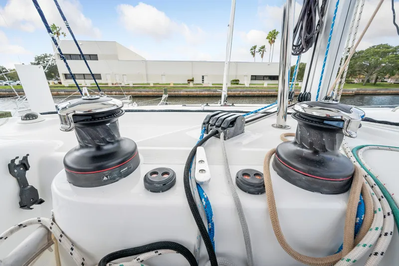 Slide: The Image of Close-up of winches and ropes on a 2018 Lagoon 42 catamaran sailboat. - 44