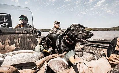 Slide: The Image of 2024 Crestliner 1660 Retriever SC with hunters, dog, and decoys on a lake. - 10