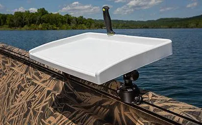 Slide: The Image of 2024 Crestliner 1660 Retriever SC with mounted white tray on patterned boat railing. - 12