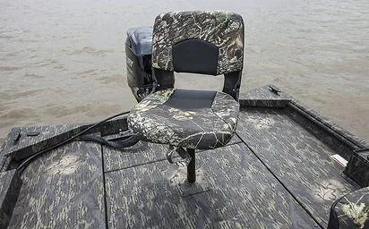 Slide: The Image of 2024 Crestliner 1660 Retriever SC boat with camo seat on a lake. - 18