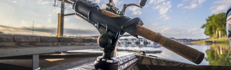 Slide: The Image of Fishing rod holder on 2024 Crestliner 1660 Retriever SC boat at sunrise by a lake. - 19