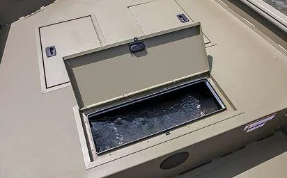 Slide: The Image of 2024 Crestliner 1660 Retriever SC boat with open storage compartment. - 20
