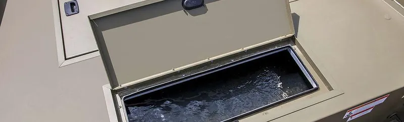 Slide: The Image of 2024 Crestliner 1660 Retriever SC livewell compartment with open lid. - 21