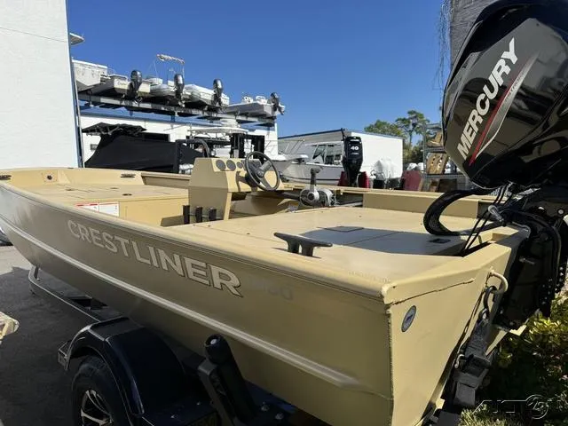 Slide: The Image of 2024 Crestliner 1660 Retriever SC boat with Mercury engine, parked outdoors. - 4