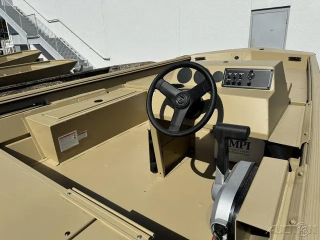 Slide: The Image of 2024 Crestliner 1660 Retriever SC boat interior with steering wheel and control panel. - 8
