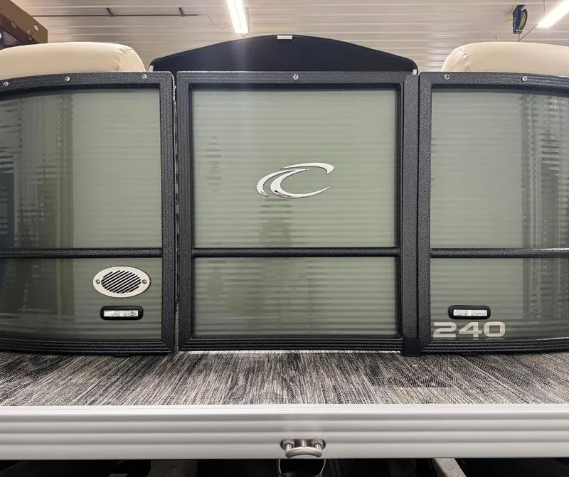 Slide: The Image of 2024 Crest Classic LX 240 pontoon boat front view in showroom. - 6