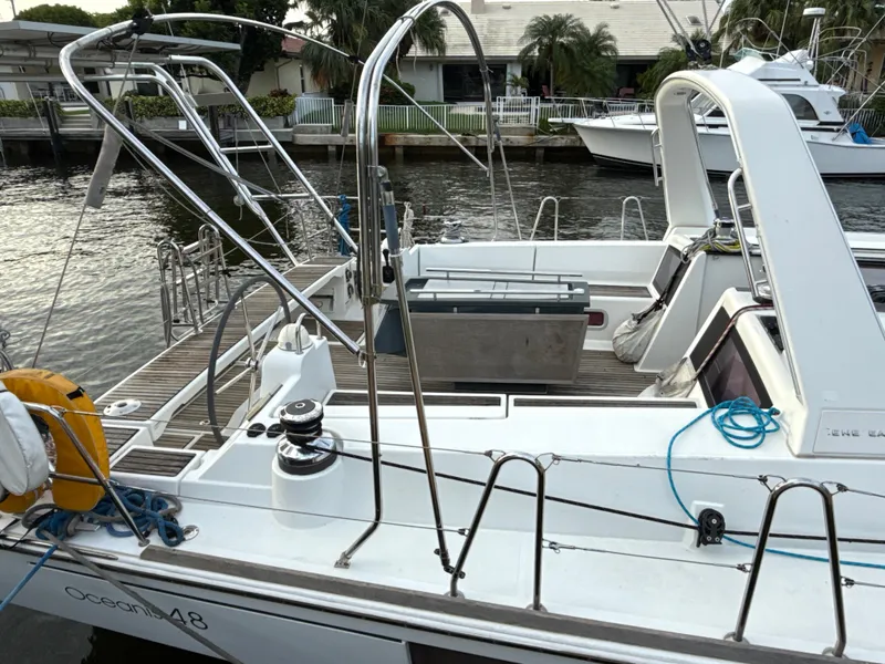 Slide: The Image of Beneteau Oceanis 48 sailboat, 2012 model, docked with visible deck and equipment. - 2