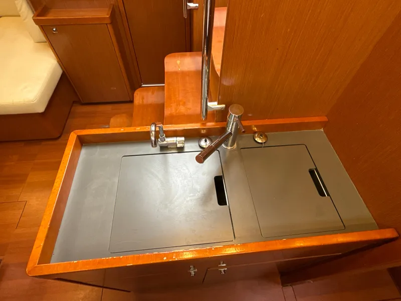Slide: The Image of Interior sink area of 2012 Beneteau Oceanis 48 yacht with wooden cabinetry. - 20