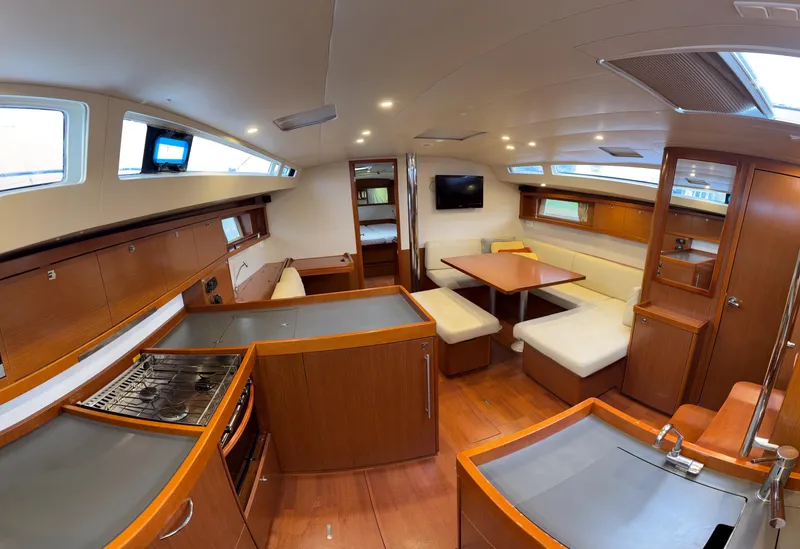 Slide: The Image of Interior of 2012 Beneteau Oceanis 48 yacht with modern kitchen and dining area. - 22