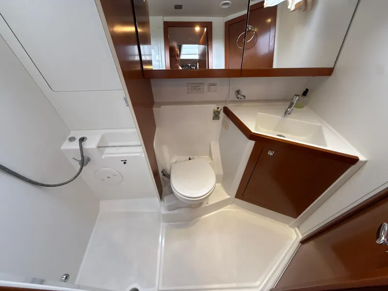 Slide: The Image of Beneteau Oceanis 48 bathroom interior, featuring modern fixtures and wood accents, 2012 model. - 24