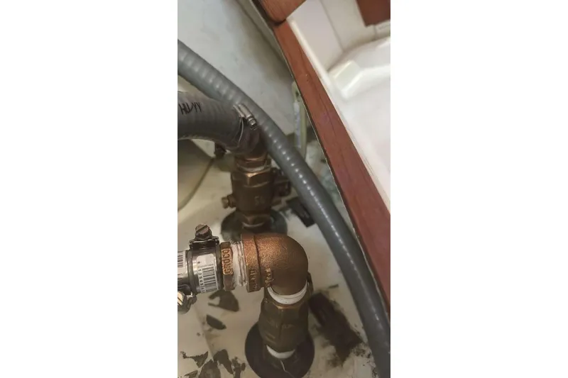 Slide: The Image of Plumbing components in a 2012 Beneteau Oceanis 48 yacht interior. - 42