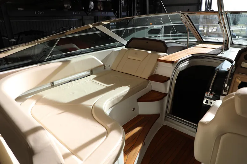Slide: The Image of 2008 Cobalt 46 yacht interior with luxurious seating and wooden accents. - 11