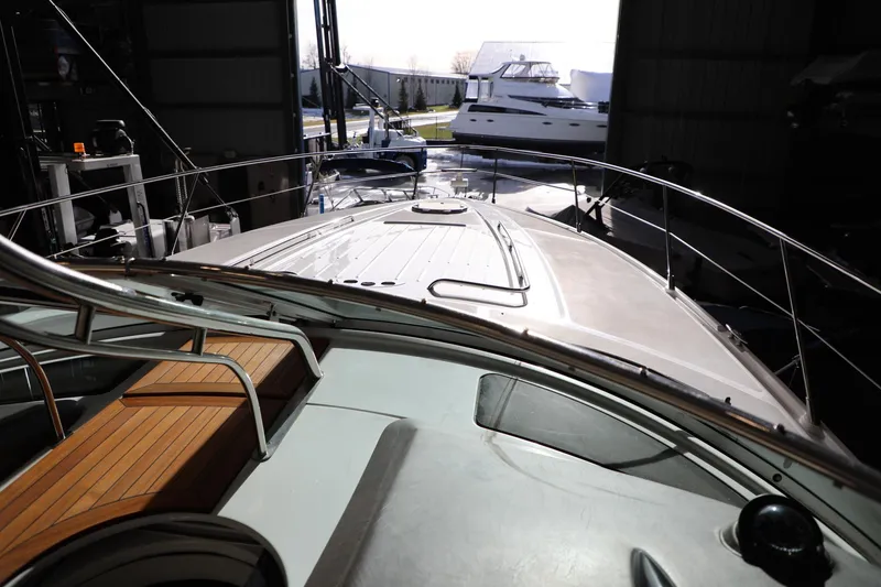 Slide: The Image of 2008 Cobalt 46 yacht docked in a marina, view from the deck. - 12