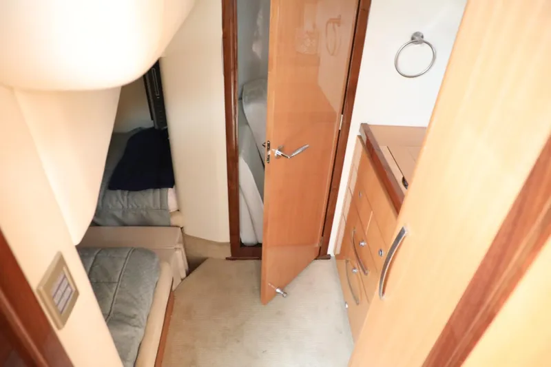 Slide: The Image of Interior cabin of a 2008 Cobalt 46 yacht with bed and wooden cabinetry. - 19
