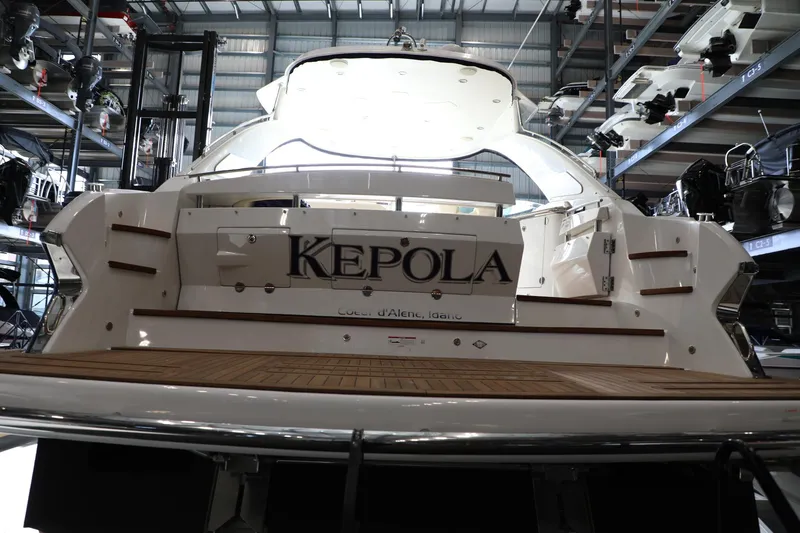 Slide: The Image of 2008 Cobalt 46 yacht in a marina, rear view. - 2