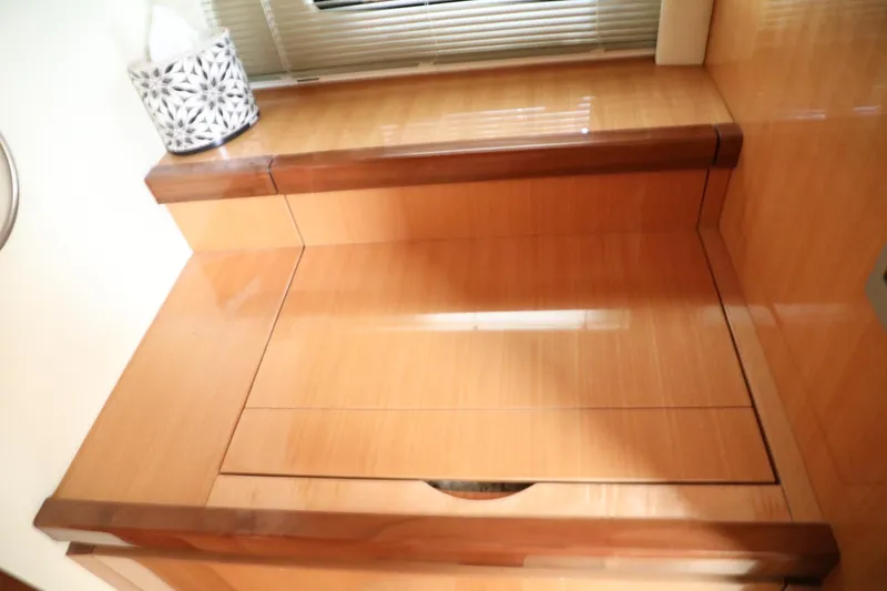 Slide: The Image of Wooden steps inside a 2008 Cobalt 46 yacht with a tissue box on top. - 20