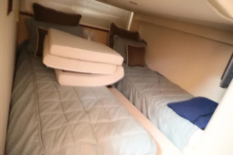 Slide: The Image of Twin beds in the cabin of a 2008 Cobalt 46 yacht. - 22