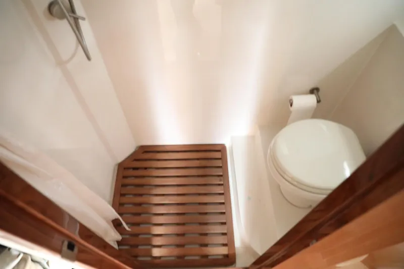 Slide: The Image of 2008 Cobalt 46 yacht bathroom with wooden shower floor and toilet. - 23