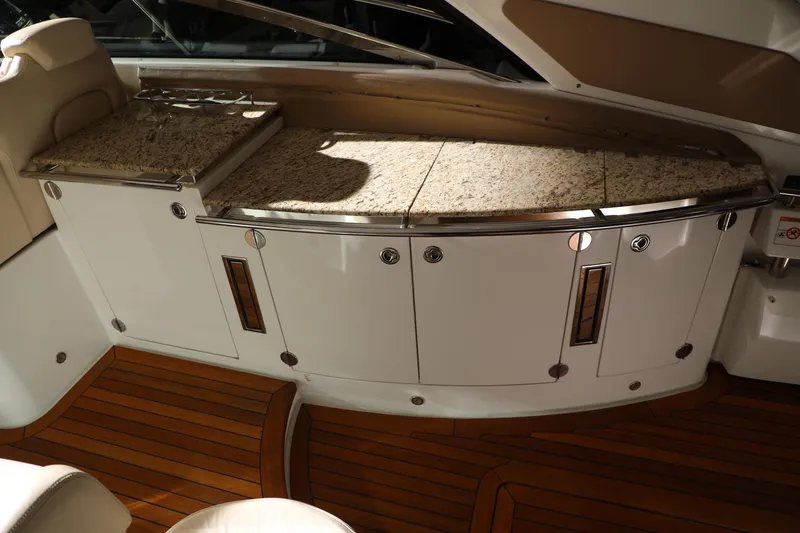 Slide: The Image of Luxurious interior of a 2008 Cobalt 46 yacht with granite countertops and wooden flooring. - 5