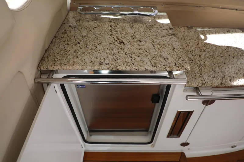 Slide: The Image of 2008 Cobalt 46 yacht kitchen with granite countertop and stainless steel mini-fridge. - 7