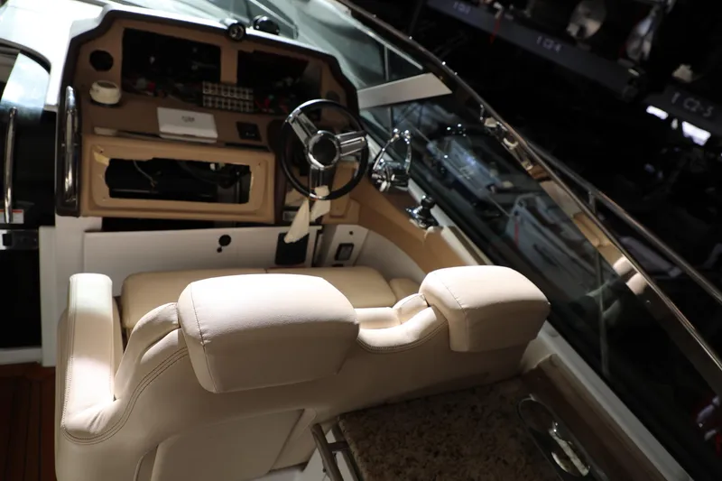 Slide: The Image of 2008 Cobalt 46 yacht cockpit with beige leather seats and modern controls. - 8