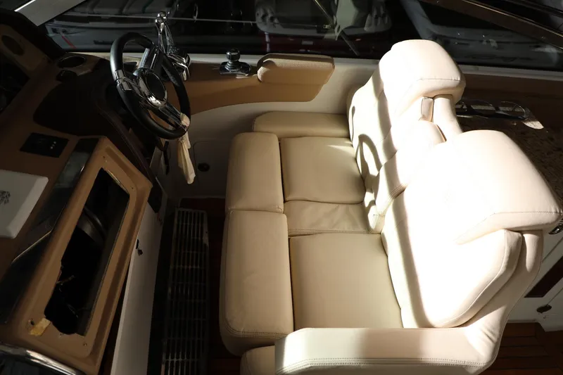 Slide: The Image of Interior helm seating of 2008 Cobalt 46 yacht with beige leather upholstery. - 9