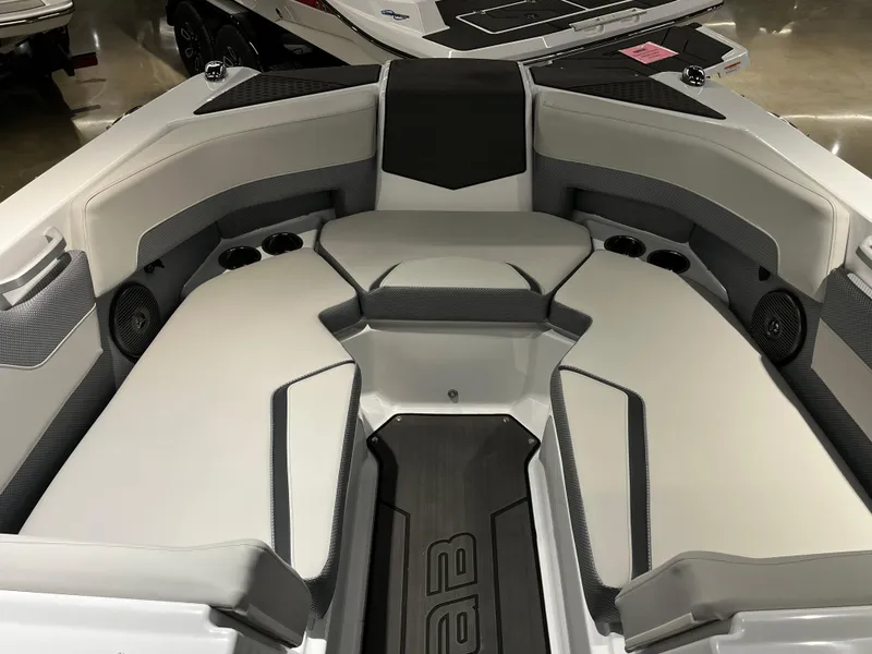 Slide: The Image of 2024 Scarab 235 ID boat interior with cushioned seating and cup holders. - 6