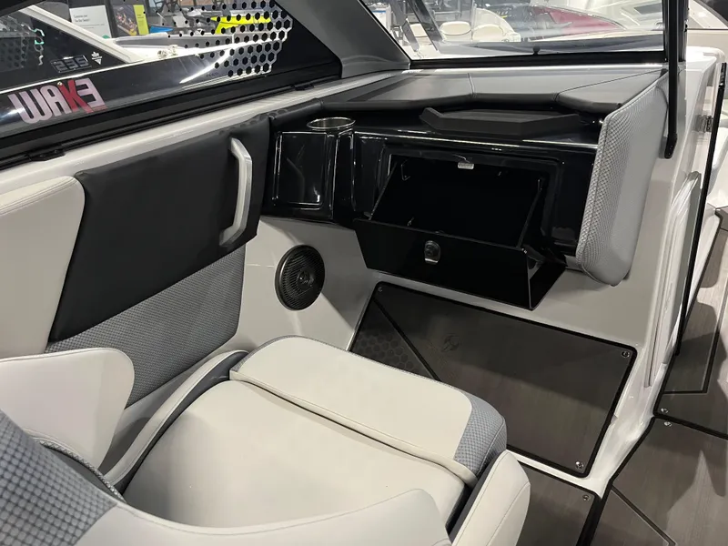 Slide: The Image of 2024 Scarab 235 ID boat interior with seating and storage compartments. - 9