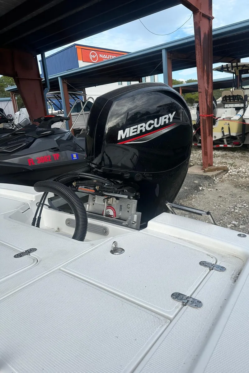 Slide: The Image of 2023 K2 Marine Frontier 2104 with Mercury outboard motor in a boatyard. - 8