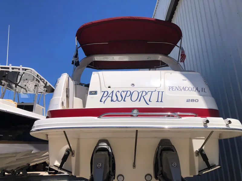 Slide: The Image of 2016 Chaparral 290 Signature boat with red canopy, docked in Pensacola, FL. - 14