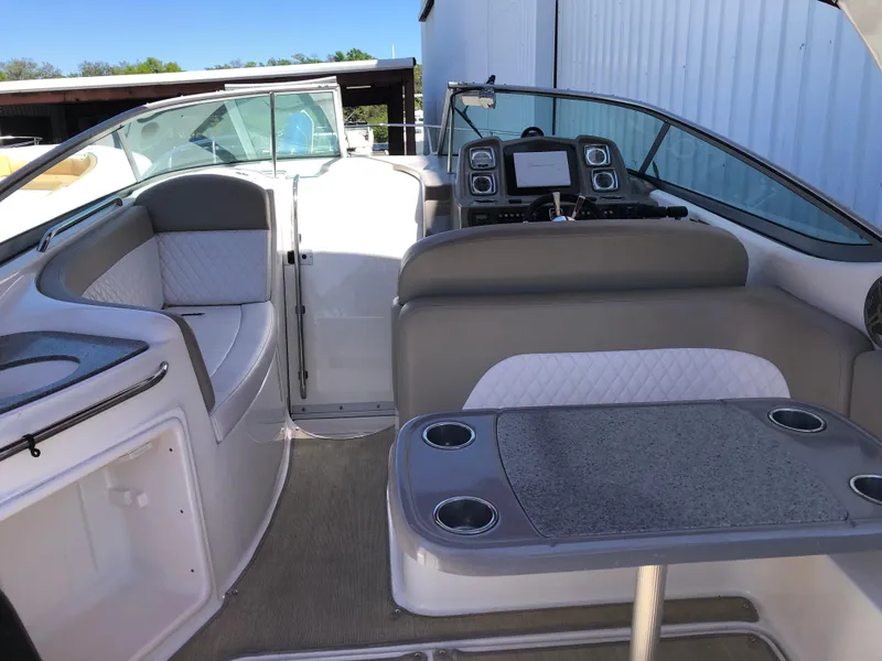 Slide: The Image of 2016 Chaparral 290 Signature boat interior with seating and control panel. - 17
