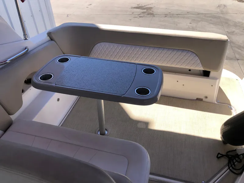Slide: The Image of 2016 Chaparral 290 Signature boat interior with seating and table. - 18