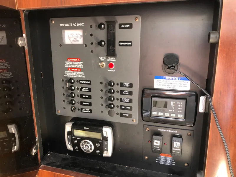 Slide: The Image of Electrical control panel in a 2016 Chaparral 290 Signature boat. - 31