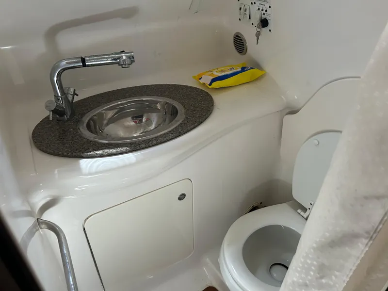 Slide: The Image of 2016 Chaparral 290 Signature boat bathroom with sink and toilet. - 39