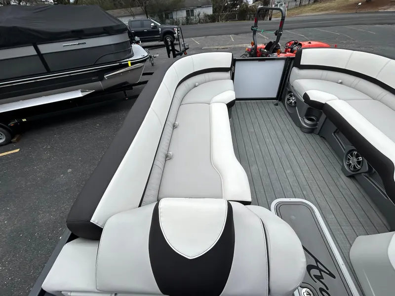 Slide: The Image of 2024 Avalon LSZ 2585 RL pontoon boat interior with spacious seating and modern design. - 12