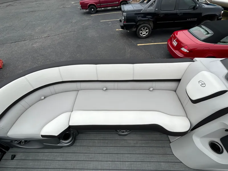 Slide: The Image of 2024 Avalon LSZ 2585 RL boat interior with white and black seating. - 13