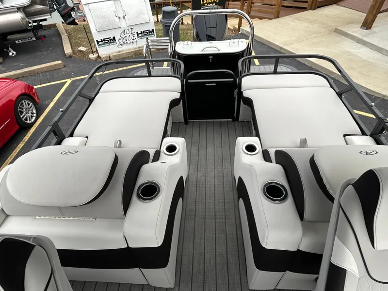 Slide: The Image of 2024 Avalon LSZ 2585 RL pontoon boat interior with luxurious seating and cup holders. - 20