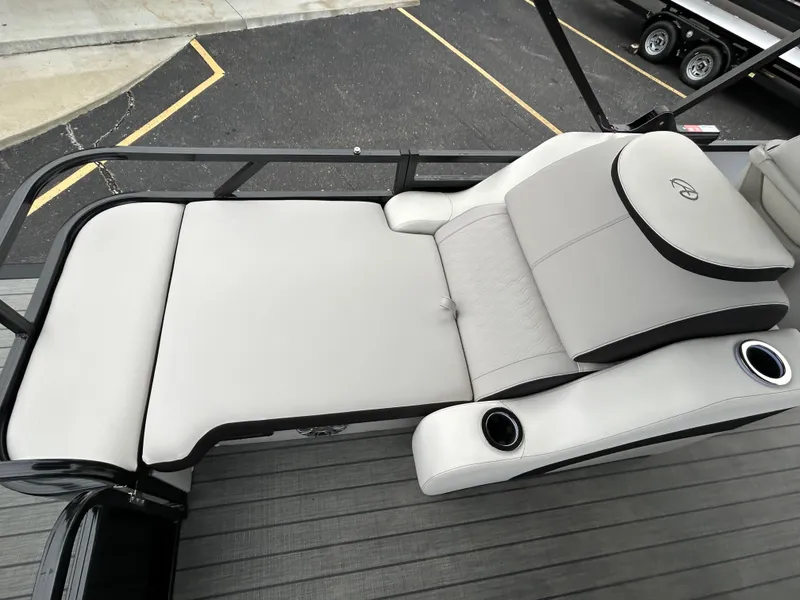 Slide: The Image of 2024 Avalon LSZ 2585 RL boat lounge seating with cup holders. - 23