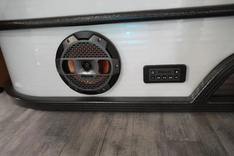 Slide: The Image of 2024 Crest Continental 250 SLC CP3 speaker and control panel on boat interior. - 10