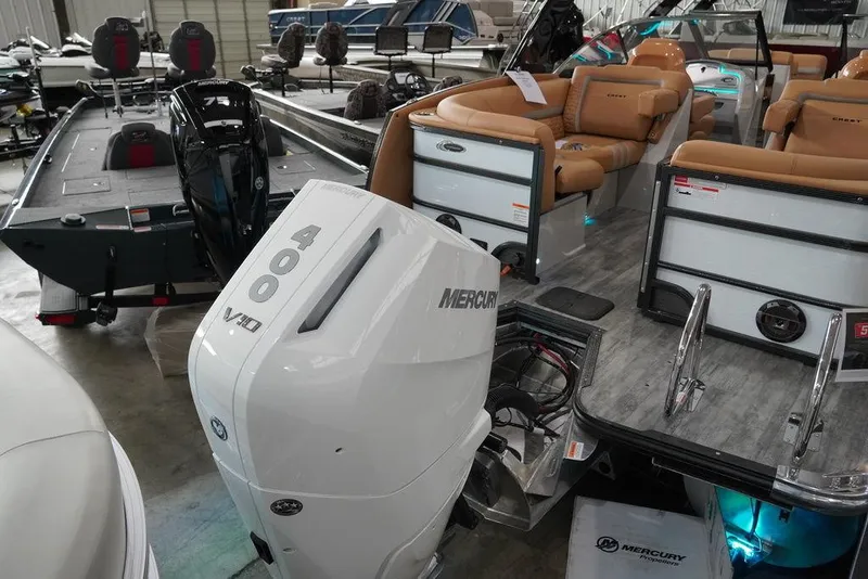 Slide: The Image of 2024 Crest Continental 250 SLC CP3 boat with 400 hp Mercury engine in showroom. - 14