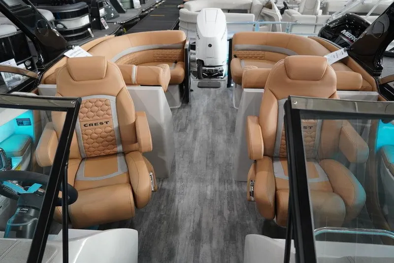 Slide: The Image of 2024 Crest Continental 250 SLC CP3 boat interior with tan leather seats and modern design. - 3
