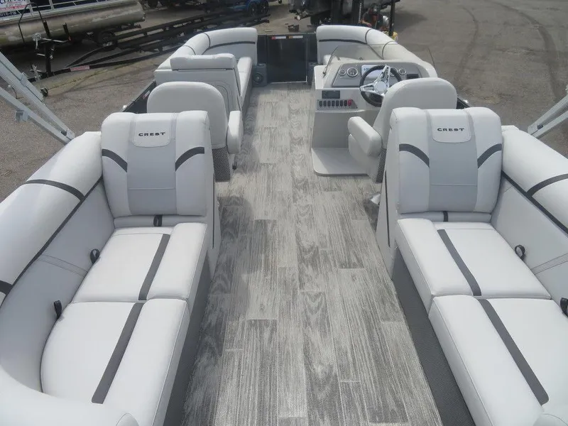 Slide: The Image of 2024 Crest CLASSIC LX 240 SLC pontoon boat with luxurious seating and modern design. - 12