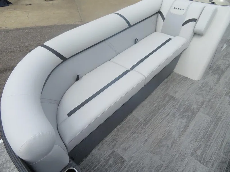 Slide: The Image of 2024 Crest CLASSIC LX 240 SLC boat interior with grey cushioned seating. - 4