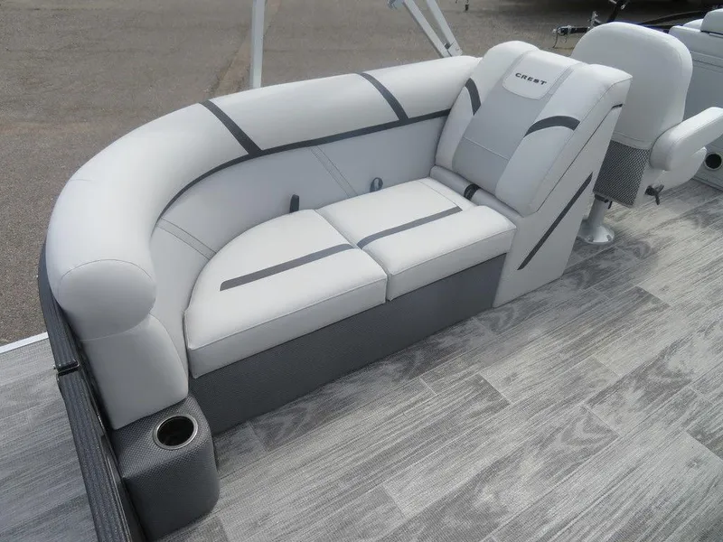 Slide: The Image of 2024 Crest CLASSIC LX 240 SLC boat interior with white and gray seating. - 9