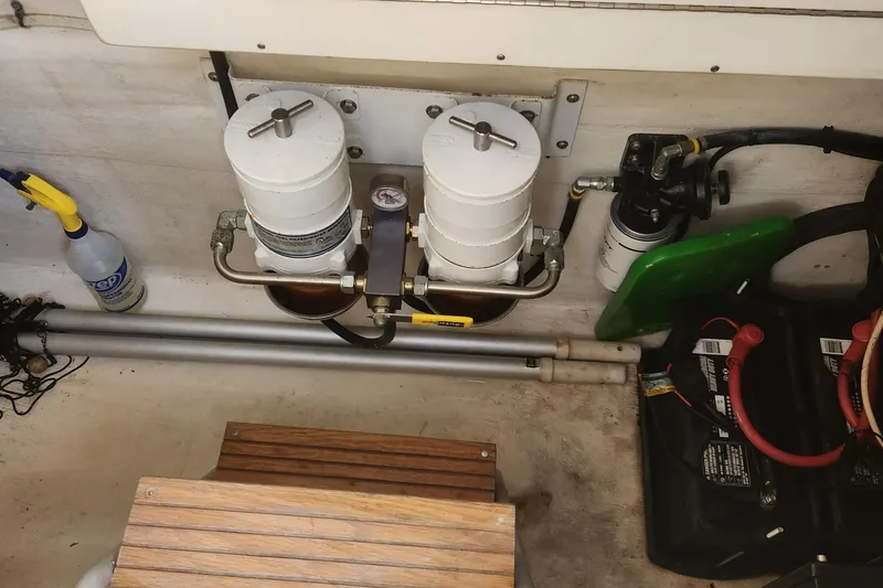 Slide: The Image of 2013 Panga Center Console boat engine compartment with fuel filters and battery. - 20