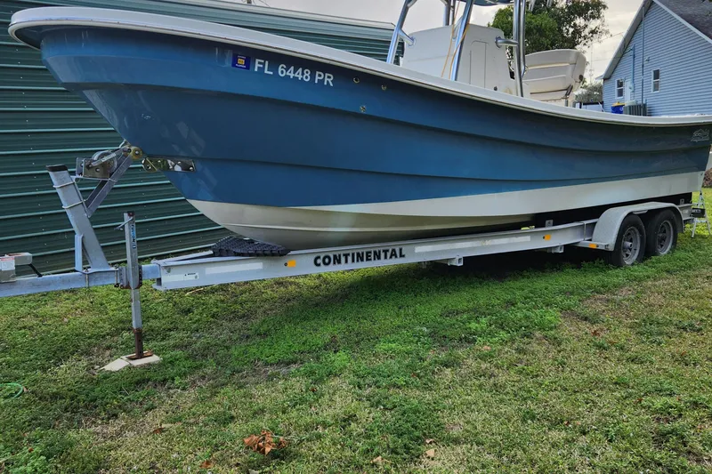 Slide: The Image of 2013 Panga Center Console boat on a Continental trailer. - 6